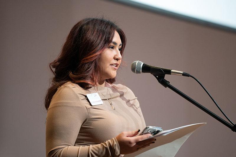 Esperanza Garcia speaks at a microphone